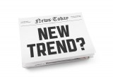 Newspaper with front headline "New Trend?"