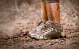 View of muddy runner shoes, standing in the mud