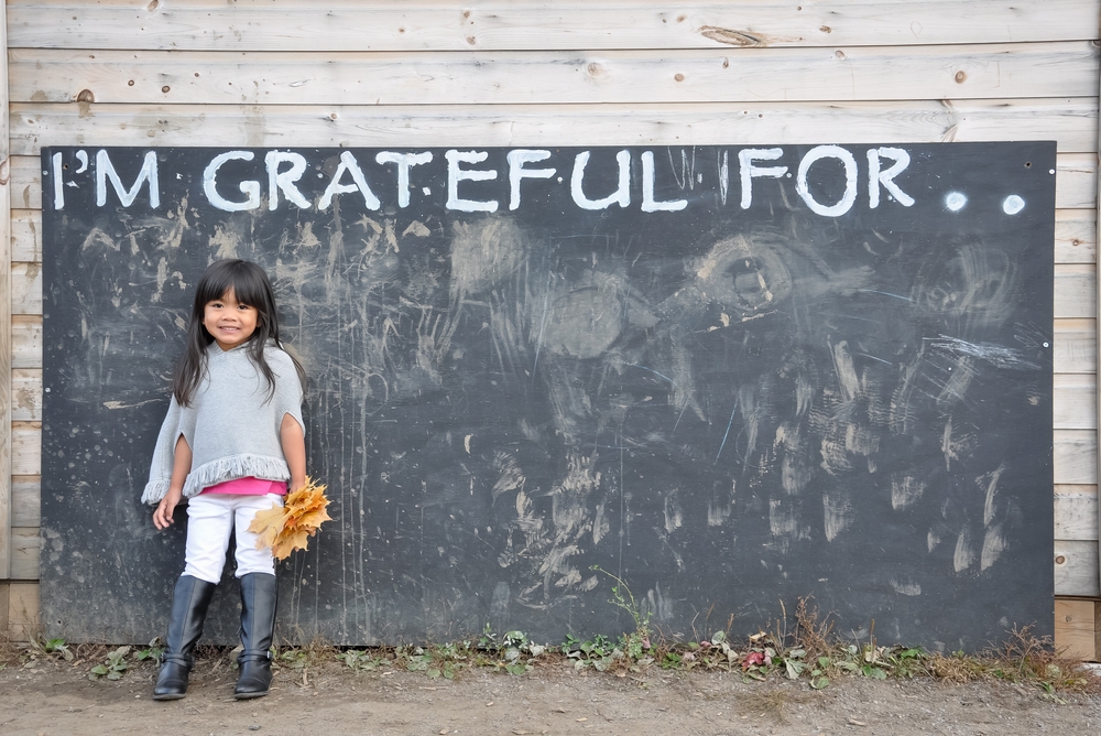 This little girl saying thanks in a Thanksgiving gym promotion.