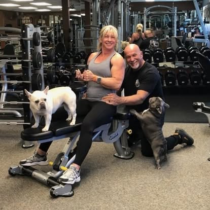 OnPoint gym owners Tawnya and Danny at the club  with their furry friends. 