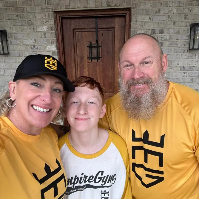 Gym owners Mary & Jamie Cain with son just before opening of Empire Gym.